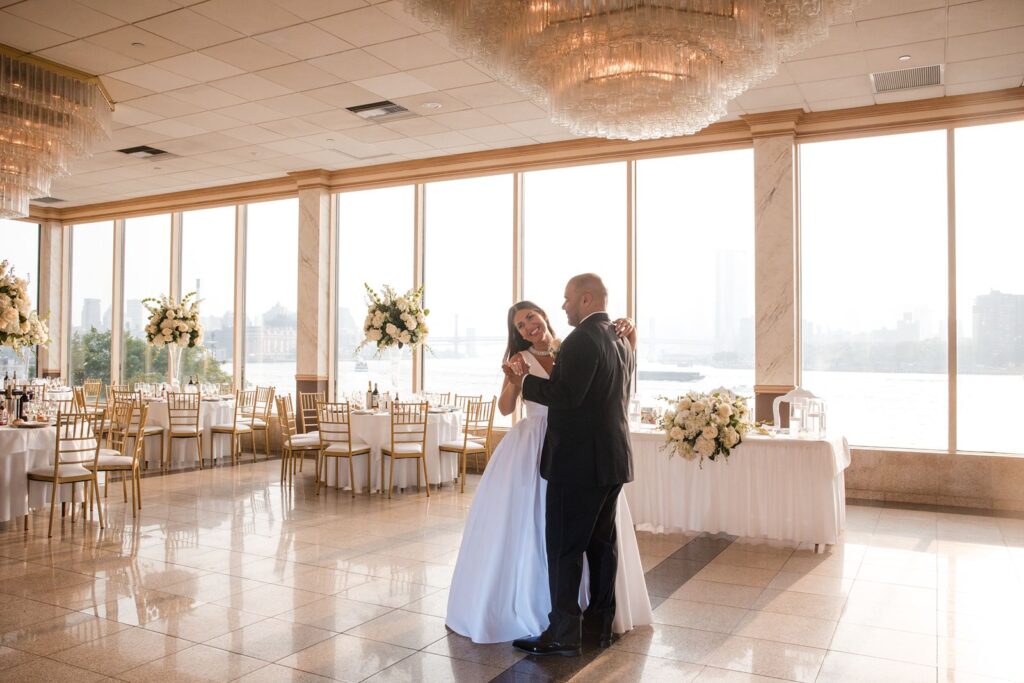 Couple enjoying a first dance during their reception reveal at Giando on the Water ballroom.