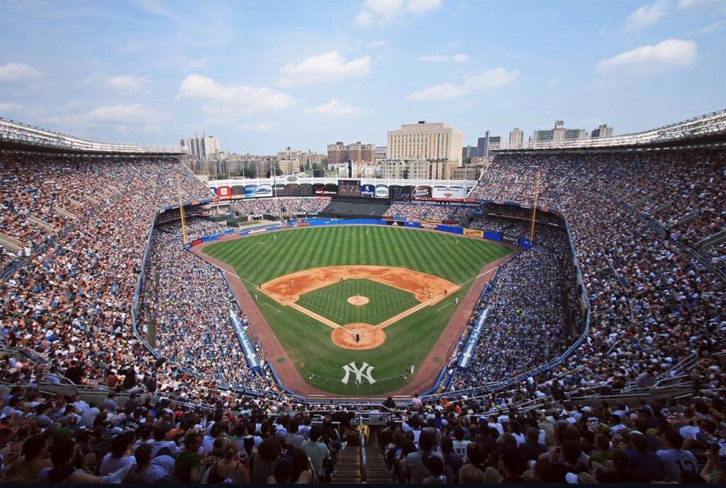 Birds eye view of a crowded Yankess stadium with the Yankee logo