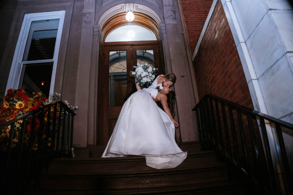 Couple enjoying a kiss at the top of the East Pole townhouse
